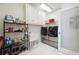 Well-equipped laundry room with modern appliances, ample storage, and functional layout at 5122 Cantrell Se Pt, Acworth, GA 30101