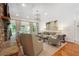 Bright living room with a stone fireplace, neutral tones, and access to an outdoor space at 5122 Cantrell Se Pt, Acworth, GA 30101