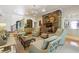 Comfortable living room featuring a stone fireplace, staircase, and access to the kitchen at 5122 Cantrell Se Pt, Acworth, GA 30101