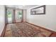Spacious living area featuring French doors leading outside, hardwood floors, and a stylish rug at 5122 Cantrell Se Pt, Acworth, GA 30101