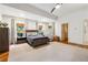 Large main bedroom with plush carpet, tray ceilings, and stylish furnishings at 5122 Cantrell Se Pt, Acworth, GA 30101