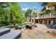 Beautiful backyard showcasing a pool, spa, outdoor fireplace and ample lounge seating at 5122 Cantrell Se Pt, Acworth, GA 30101
