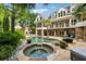 Backyard paradise with a luxurious pool, spa, stone patio, and outdoor fireplace, perfect for entertaining at 5122 Cantrell Se Pt, Acworth, GA 30101