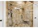 Luxurious walk-in shower with decorative tiles and a built-in seat at 5122 Cantrell Se Pt, Acworth, GA 30101