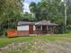 View of the front of the charming home with front porch, side deck and partial brick facade at 6925 Buchanan Hwy, Dallas, GA 30157