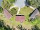 Aerial view of the home showcasing its roof, yard, and proximity to neighboring properties at 7371 Ovis Ct, Riverdale, GA 30274