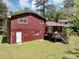 A backyard featuring a wood deck and mature trees at 7371 Ovis Ct, Riverdale, GA 30274