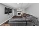 Finished basement with a large sectional couch and a fireplace at 7371 Ovis Ct, Riverdale, GA 30274