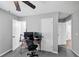 Bedroom featuring neutral walls, two closets and a workstation at 7371 Ovis Ct, Riverdale, GA 30274