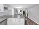 Open concept dining area with hardwood floors and a modern light fixture at 7371 Ovis Ct, Riverdale, GA 30274