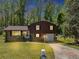 Charming two-story home with brick and brown siding, featuring a well-manicured lawn at 7371 Ovis Ct, Riverdale, GA 30274