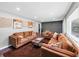 Inviting living room with wood-look floors, recessed lighting, and comfortable, modern furnishings at 7371 Ovis Ct, Riverdale, GA 30274
