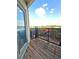 Cozy balcony featuring wooden flooring, black railing, and outdoor views at 898 Oak Sw St # 1418, Atlanta, GA 30310