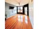 Open-concept living room with hardwood floors, black accent wall and outdoor access at 898 Oak Sw St # 1418, Atlanta, GA 30310
