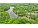 Scenic aerial view showcases a lake surrounded by lush trees and homes at 1412 Lanier Ne Mnr, Atlanta, GA 30319