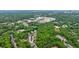 Aerial view of residential and commercial area with mature trees and city skyline in the background at 1412 Lanier Ne Mnr, Atlanta, GA 30319
