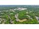 Aerial view of neighborhood with lush trees, homes, and businesses, offering a peek into the community at 1412 Lanier Ne Mnr, Atlanta, GA 30319
