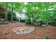 Expansive backyard featuring well maintained trees, plants, stone work and landscaping at 1412 Lanier Ne Mnr, Atlanta, GA 30319