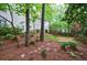 Well-maintained backyard with lush landscaping, trees, and greenery, creating a serene outdoor space at 1412 Lanier Ne Mnr, Atlanta, GA 30319