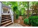 Beautifully landscaped backyard with lush greenery and stone accents, offering a private outdoor retreat at 1412 Lanier Ne Mnr, Atlanta, GA 30319