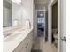 Elegant bathroom with white cabinetry, neutral colors, and seamless flow to bedroom at 1412 Lanier Ne Mnr, Atlanta, GA 30319