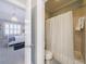 Bathroom connecting to bedroom features a bathtub with shower curtain at 1412 Lanier Ne Mnr, Atlanta, GA 30319