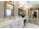 Spacious bathroom featuring dual sinks with neutral countertops and luxury tile flooring at 1412 Lanier Ne Mnr, Atlanta, GA 30319