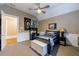 Comfortable bedroom featuring sporty decor, a cozy bed, and a large window at 1412 Lanier Ne Mnr, Atlanta, GA 30319