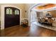 Elegant dining room with a decorative ceiling, chandelier, and large arched window at 1412 Lanier Ne Mnr, Atlanta, GA 30319