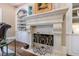 Close-up of the living room fireplace featuring white mantle, and decorative iron screen at 1412 Lanier Ne Mnr, Atlanta, GA 30319