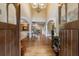 Grand foyer with hardwood floors, soaring ceilings, and an elegant chandelier at 1412 Lanier Ne Mnr, Atlanta, GA 30319