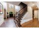 Spacious foyer with hardwood floors, staircase, and elegant lighting at 1412 Lanier Ne Mnr, Atlanta, GA 30319