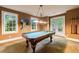 Recreation room featuring a billiard table, art, and access to a serene outdoor space through French doors at 1412 Lanier Ne Mnr, Atlanta, GA 30319