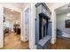 Hallway featuring convenient storage bench and access to kitchen and other living spaces at 1412 Lanier Ne Mnr, Atlanta, GA 30319