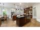 Spacious kitchen with dark wood cabinetry, granite counters, large island, and stainless steel appliances at 1412 Lanier Ne Mnr, Atlanta, GA 30319