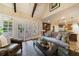 Spacious living room with hardwood floors, natural light, and seamless flow to kitchen area at 1412 Lanier Ne Mnr, Atlanta, GA 30319