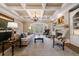 Elegant living room featuring coffered ceilings, fireplace, built-in shelving, and large windows at 1412 Lanier Ne Mnr, Atlanta, GA 30319