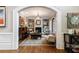 Cozy living room featuring a fireplace, built-in bookshelves, and ample natural light at 1412 Lanier Ne Mnr, Atlanta, GA 30319
