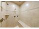 Elegant shower with neutral tile, a built-in bench, and multiple shower heads at 1412 Lanier Ne Mnr, Atlanta, GA 30319