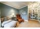 Comfortable sitting area features built-in bookshelves, soft carpet, and a leather armchair at 1412 Lanier Ne Mnr, Atlanta, GA 30319
