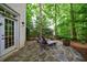 Stone patio with lounge chairs offering a tranquil outdoor seating area for relaxation and leisure at 1412 Lanier Ne Mnr, Atlanta, GA 30319