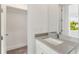 Bathroom featuring modern sink and plenty of storage space with natural light at 241 Maynard Se Ter # 18, Atlanta, GA 30316