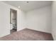Neutral toned bedroom adjacent to a bathroom featuring plush carpeting at 241 Maynard Se Ter # 18, Atlanta, GA 30316