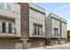 Modern townhouse with gray siding, brick accents, garages, and small balconies at 241 Maynard Se Ter # 18, Atlanta, GA 30316