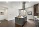 Open concept kitchen with a center island, stainless steel appliances, and dark hardwood floors at 241 Maynard Se Ter # 18, Atlanta, GA 30316