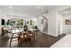 Bright living room and dining area with hardwood floors, a glass-top dining table, and natural light at 241 Maynard Se Ter # 18, Atlanta, GA 30316