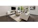 Stylish living room featuring a comfortable sofa, modern chairs, a patterned rug, and large windows at 241 Maynard Se Ter # 18, Atlanta, GA 30316