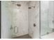 Enclosed shower with marble tile, dual shower heads and modern hardware at 241 Maynard Se Ter # 18, Atlanta, GA 30316