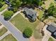 Stunning aerial view of the home showcases its well-manicured lawn, lush landscaping, and architectural details at 4013 Dover Ave, Alpharetta, GA 30009