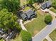 Bird's-eye view of this charming home with mature trees, green lawns, and a well-designed deck area at 4013 Dover Ave, Alpharetta, GA 30009